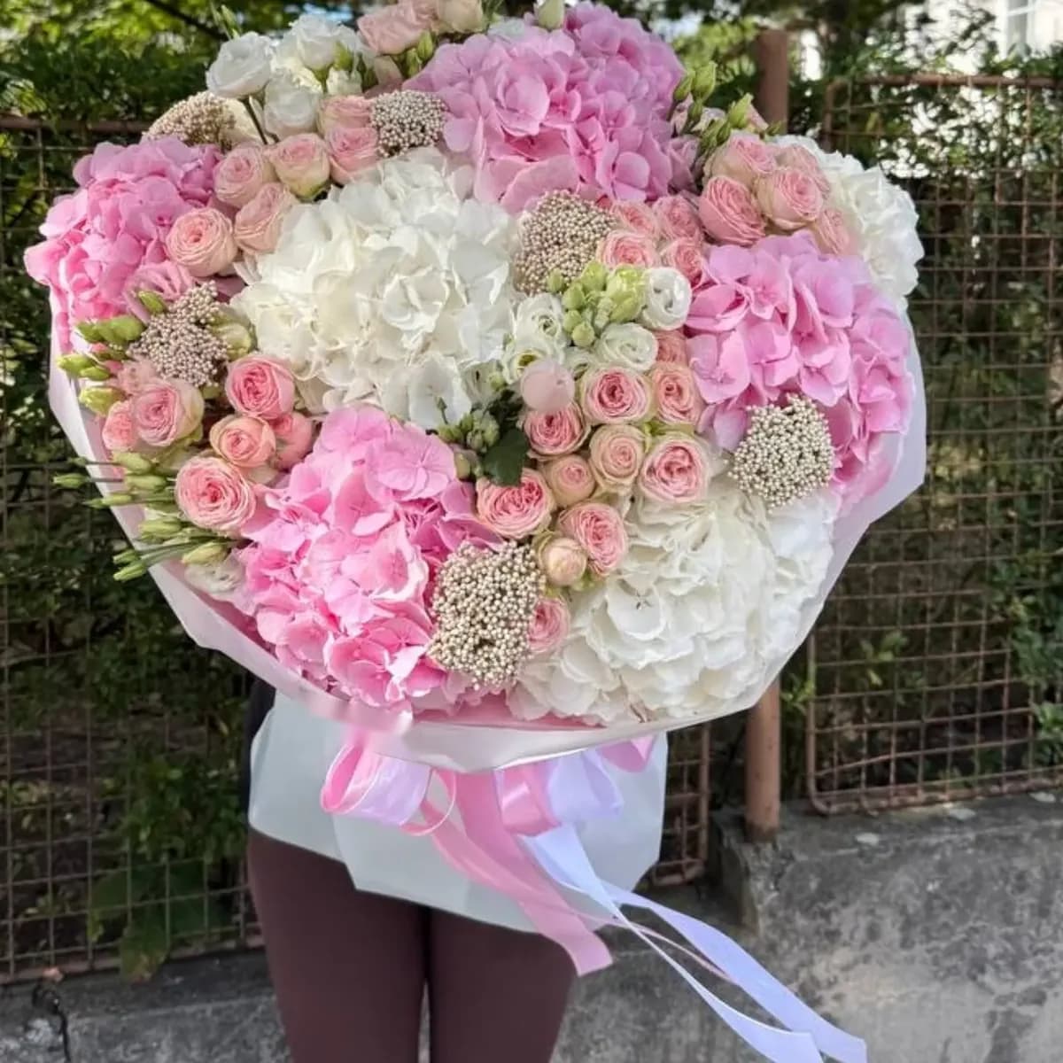 Pink and white hydrangea bouquet with blush spray roses by Flowers Lovers LA